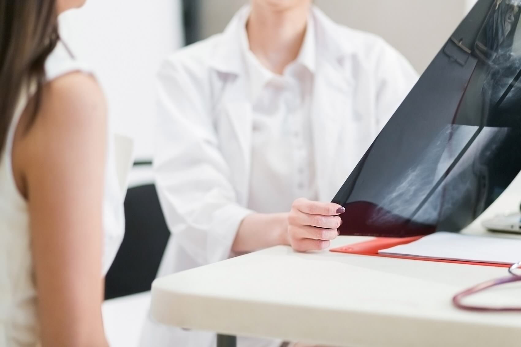 OBGYN Provider looking over mammogram results with patient